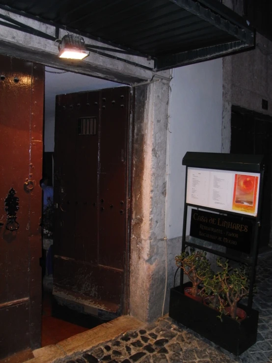 a set of brown lockers and a floor lamp in a building