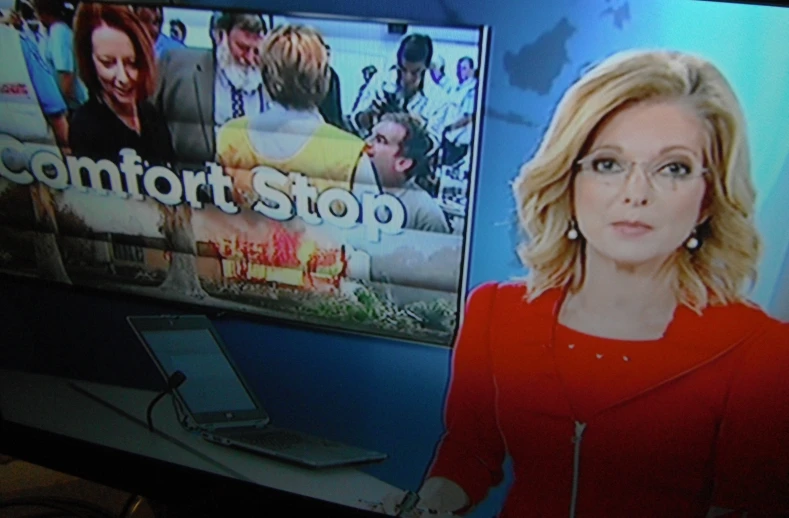 a news anchor's picture shows the company's business on her tv show