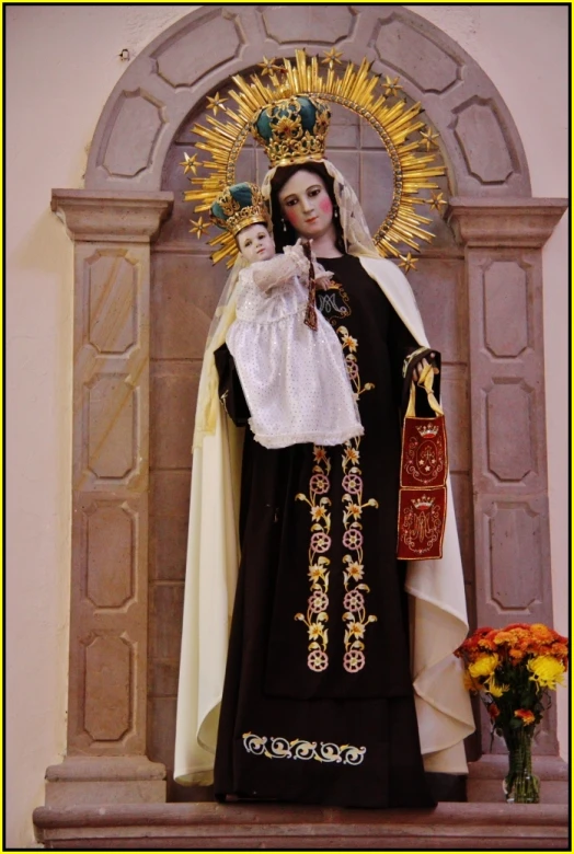 the statue of the virgin mary in the center of a church