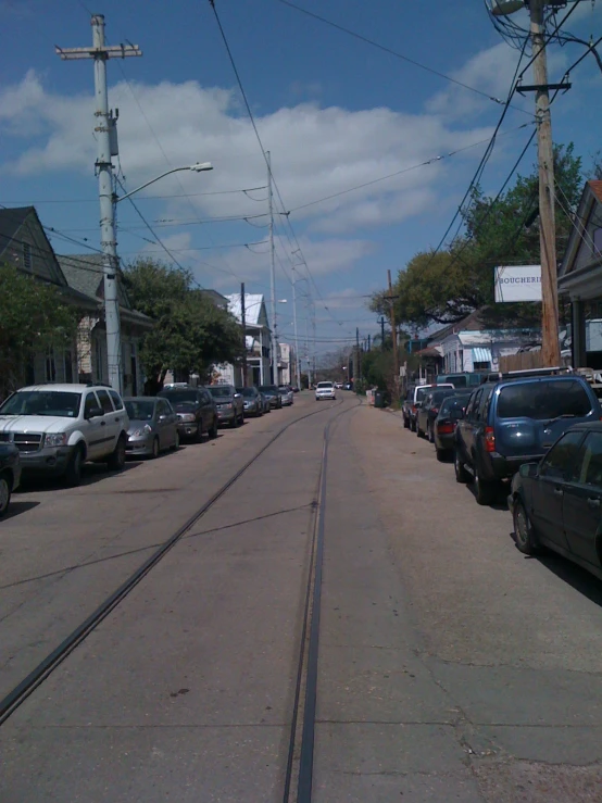 cars parked along the side of a street