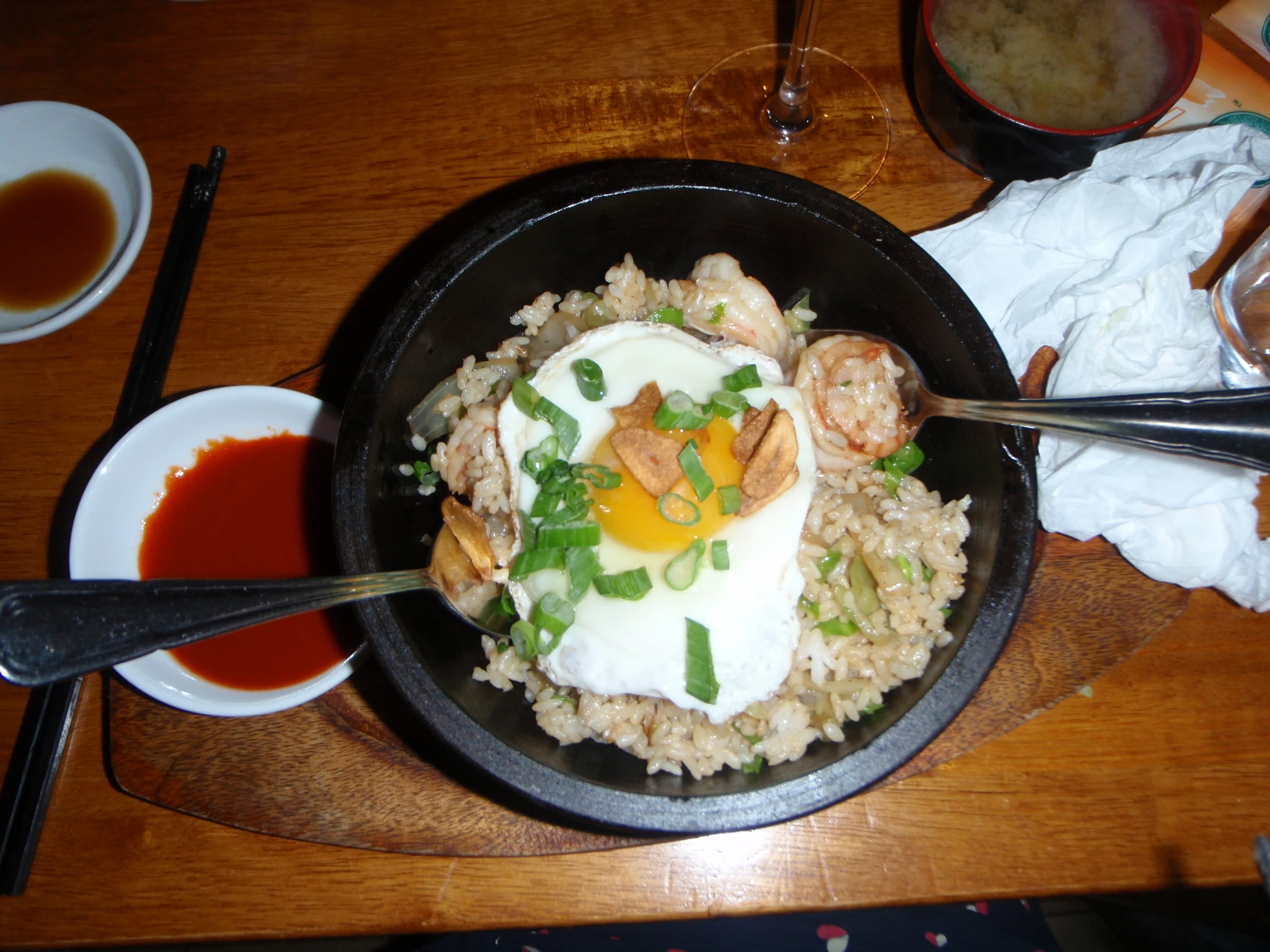 a bowl of food with meat and an egg in a bowl