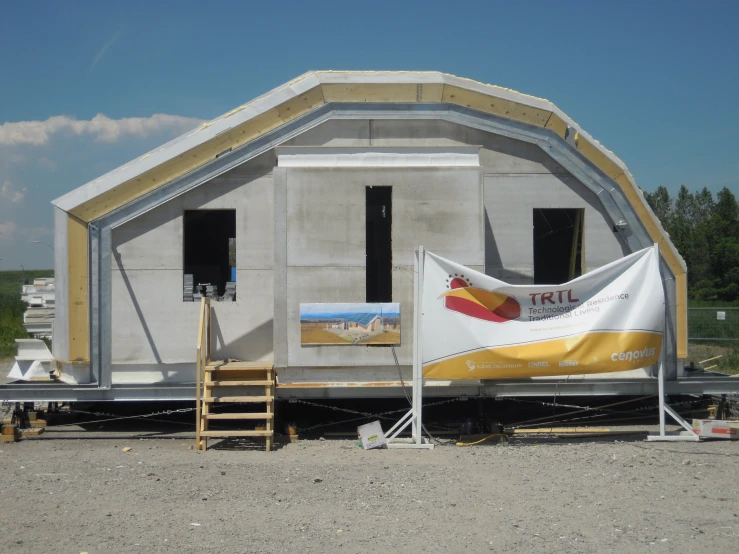 a large tent structure with a flag on the outside