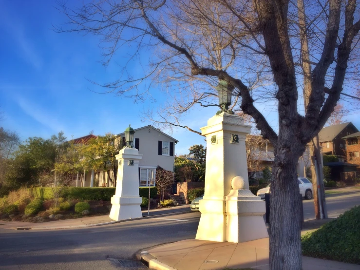 some white houses and one is on the side walk