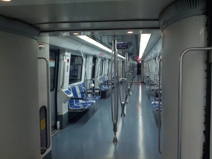 view from inside a metro train looking toward the front seats