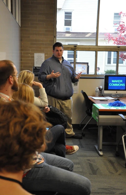 several people in a room having a presentation