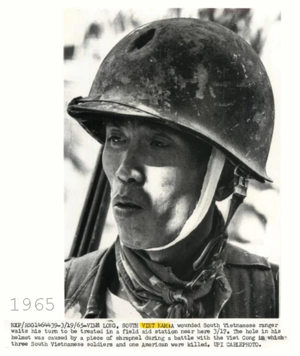 a man wearing a helmet with a serious look on his face