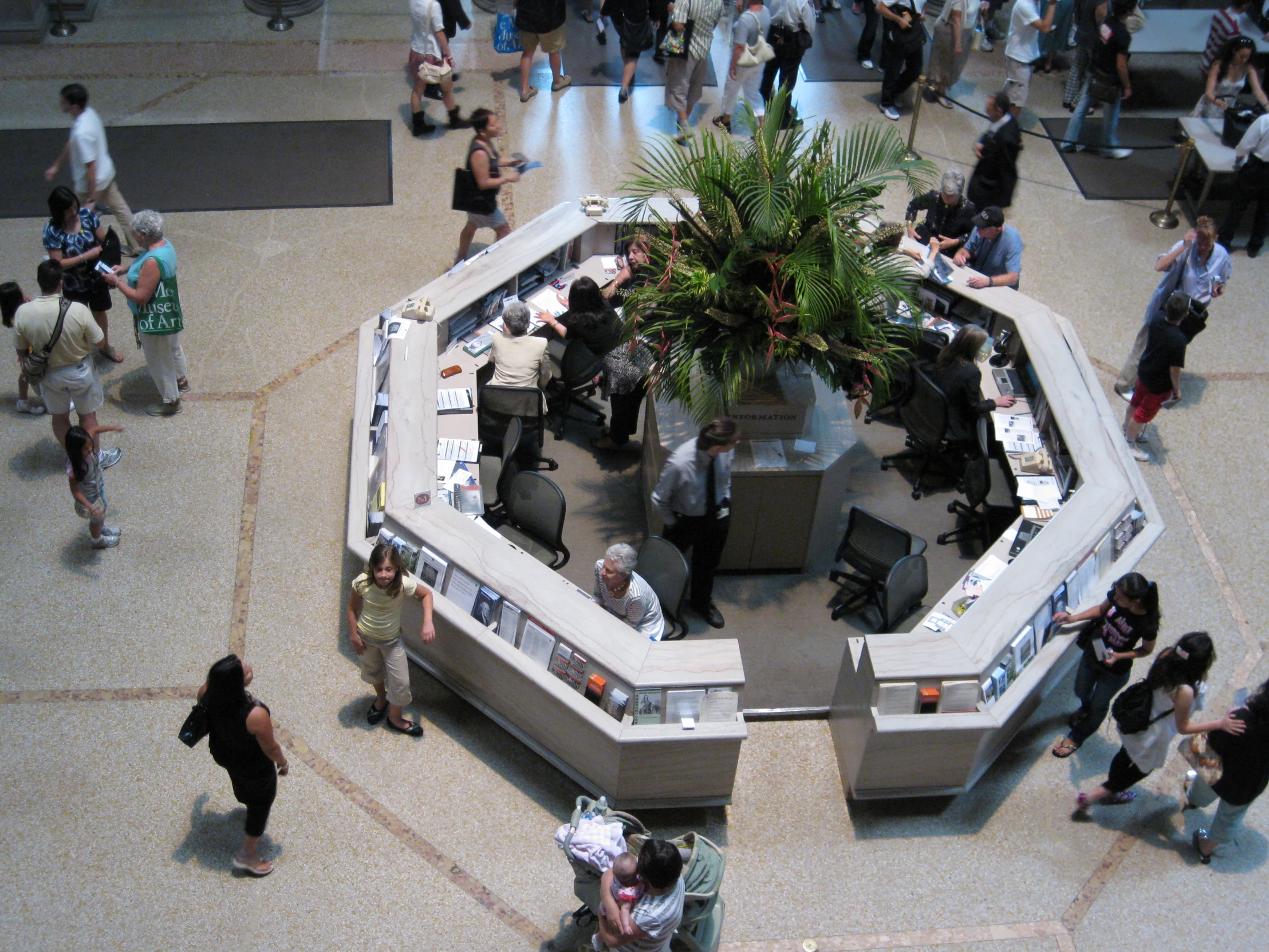 people walking around a shopping center in a mall