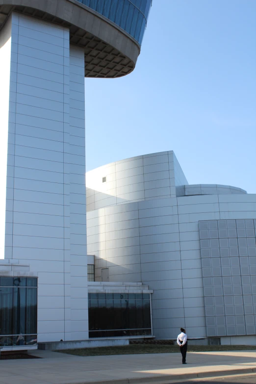 a man is walking by a building near it