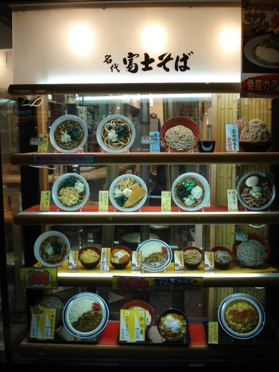 a display case filled with dishes and plates