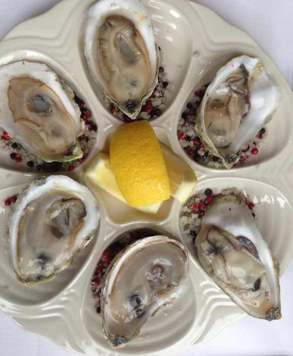 a plate filled with several large clams