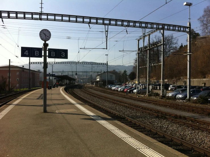 an empty train track with several traffic lights