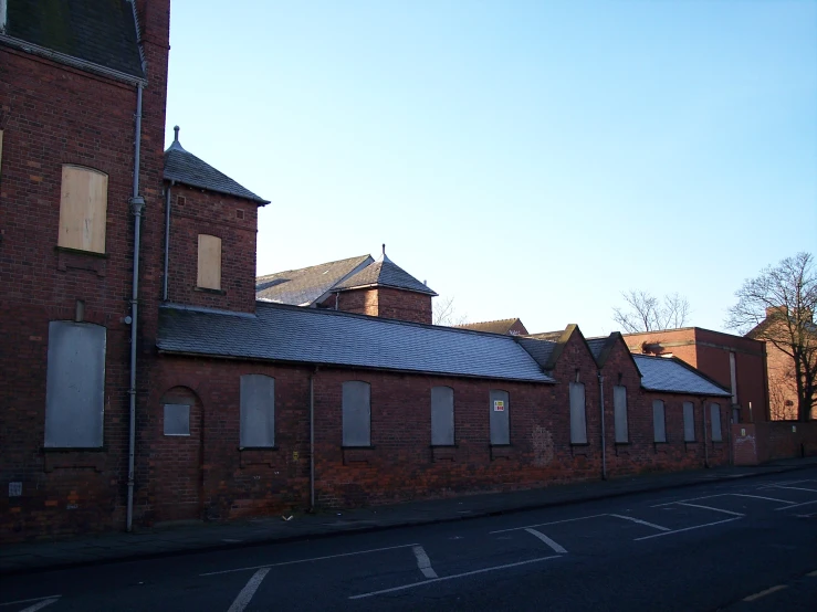 a line of brick buildings with some doors