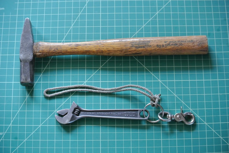 an old axe with a keychain on top of it