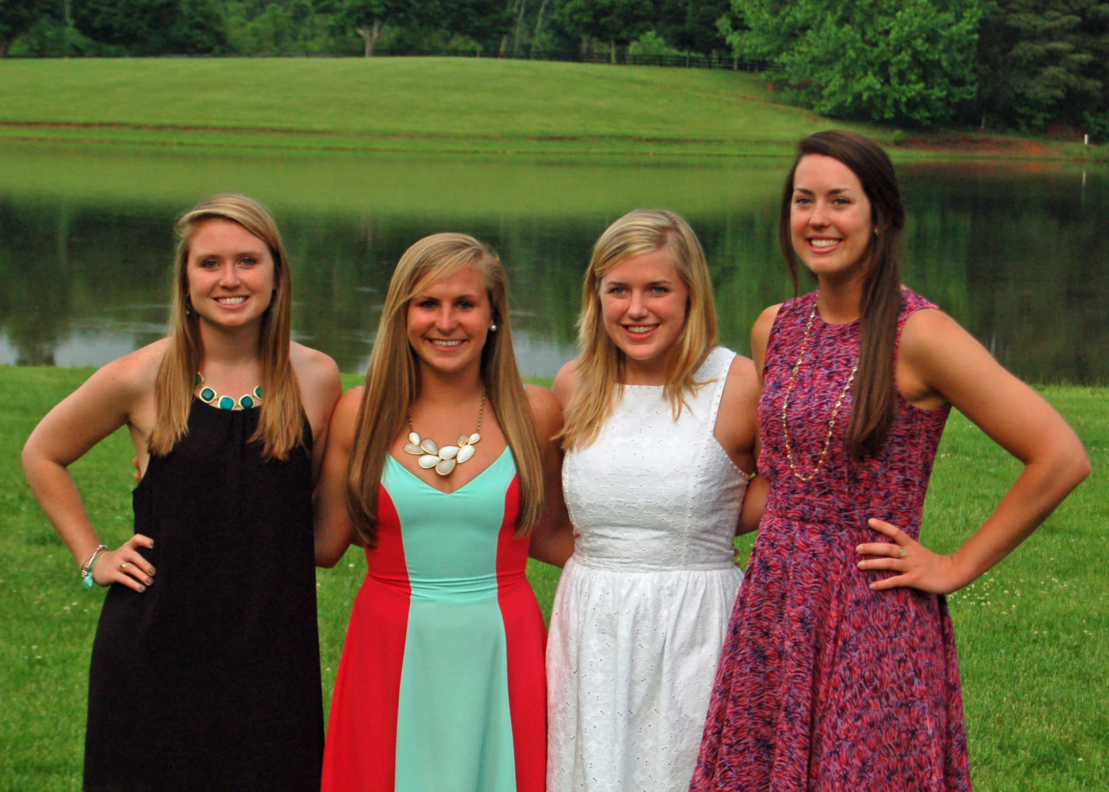 a group of young ladies are standing next to each other