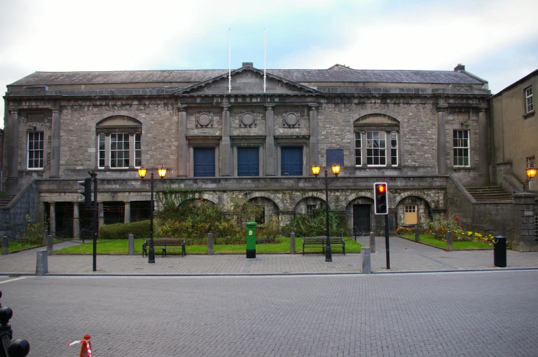 an old building with many windows and lamps