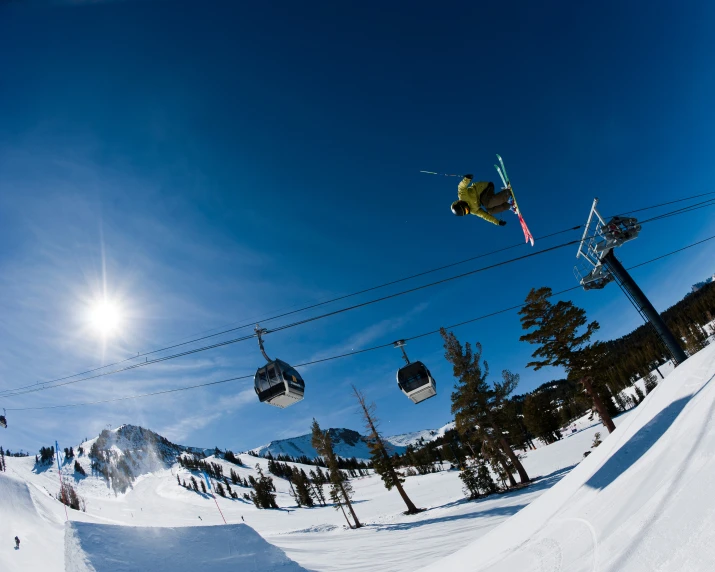 snow boarder in the air in front of the camera