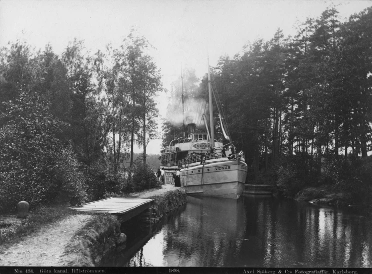 a boat on the water in a pond