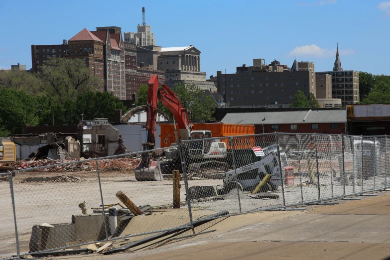 a construction site in front of a large city