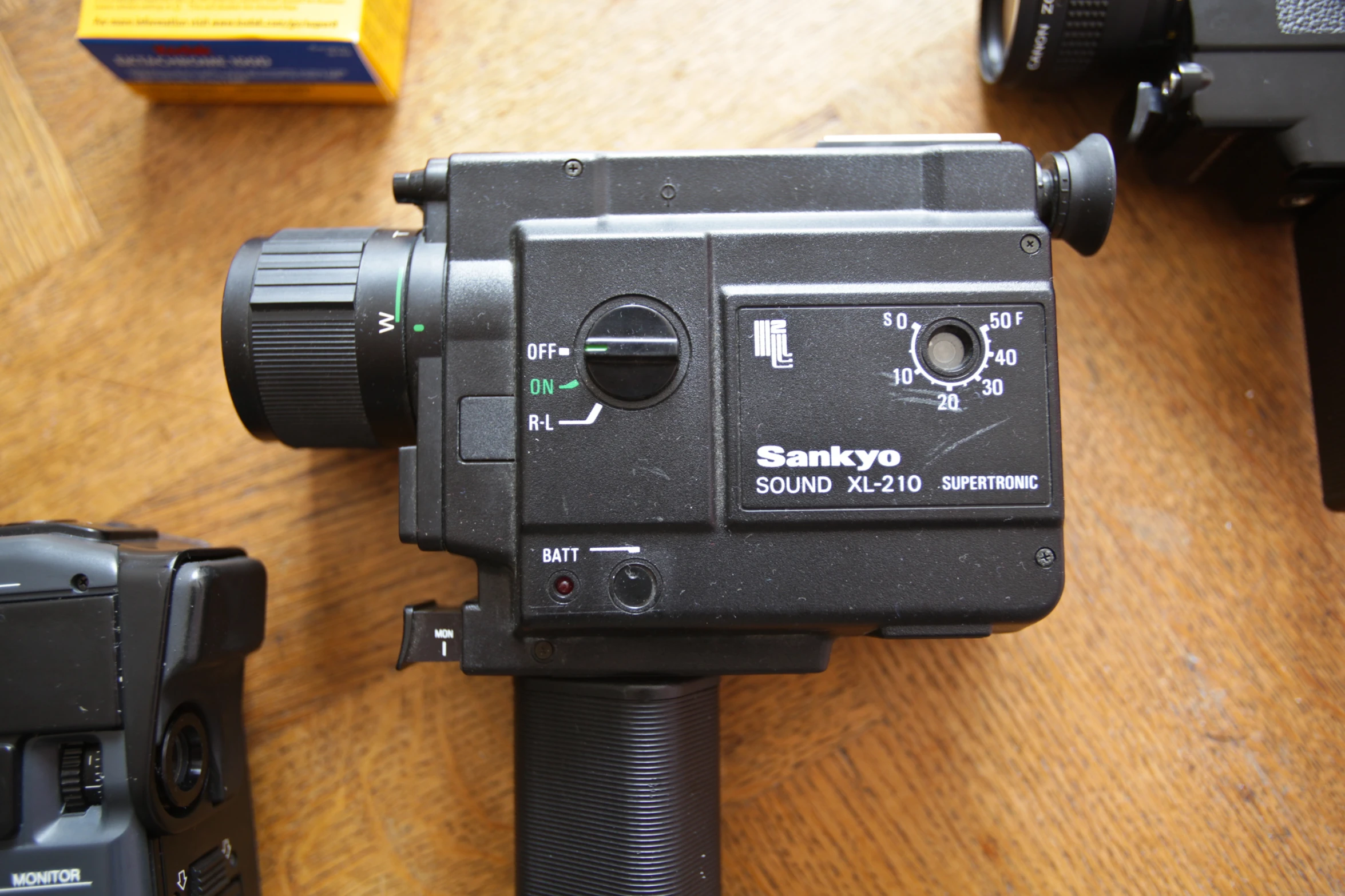 a video camera sitting on top of a wooden floor