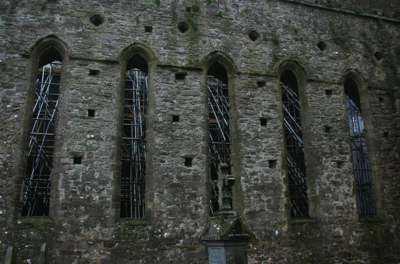 the wall of the church is exposed and broken