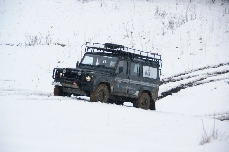 a jeep driving in the snow with no other vehicle