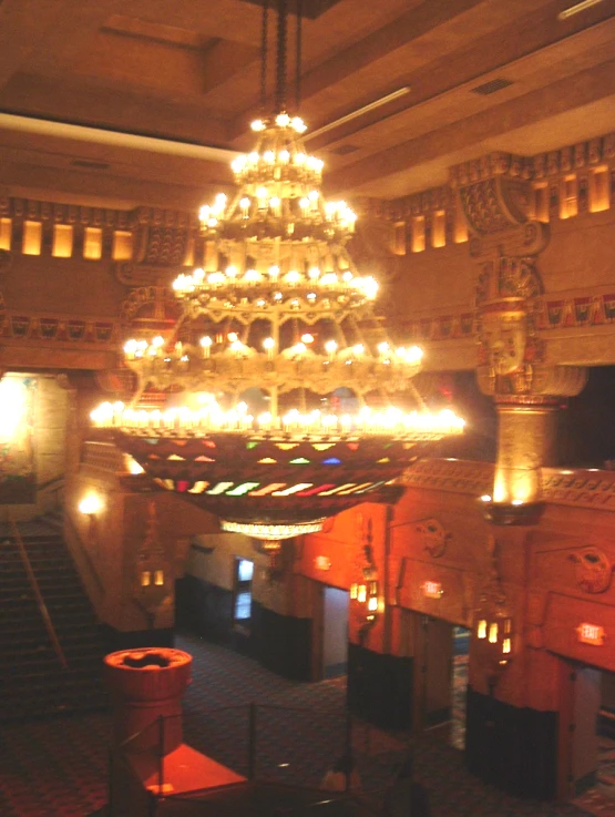 a christmas tree sitting on top of a grand stair case