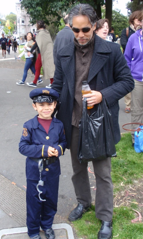 an image of a little boy dressed up as a police officer