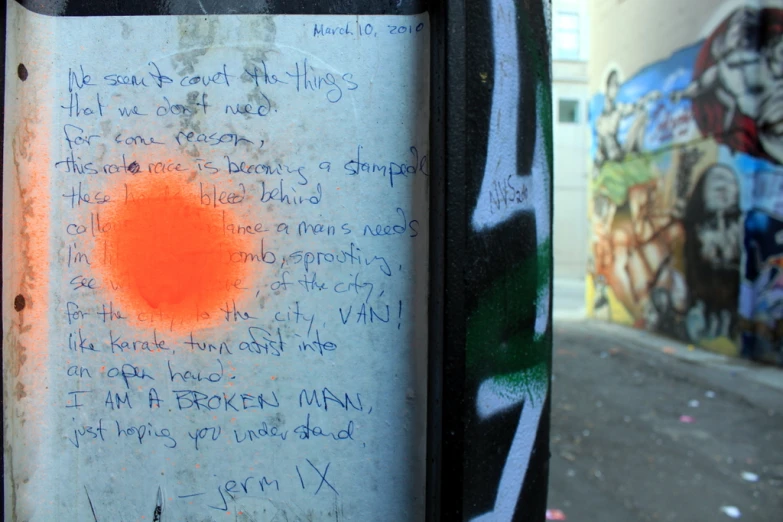 a hand written note on a phone pole