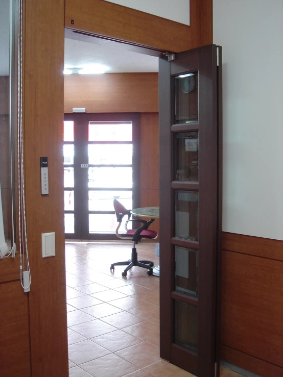 a tall open door inside an office building