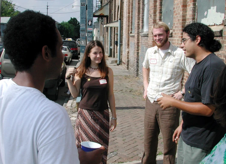 the young people are chatting near the street