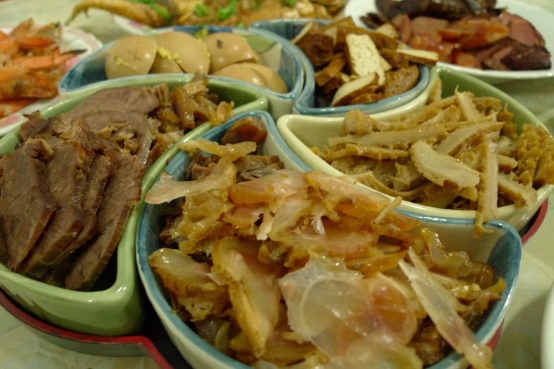 a plate full of different bowls filled with various foods