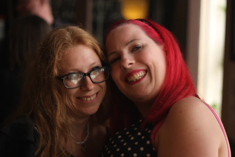 two red haired girls pose for a picture