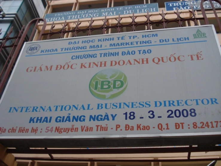 a sign with asian and english writing on it