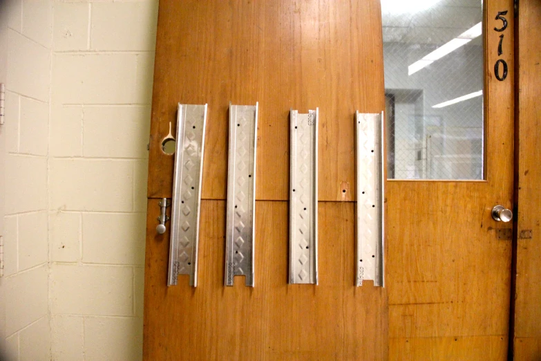 door with six long strips of wood next to it