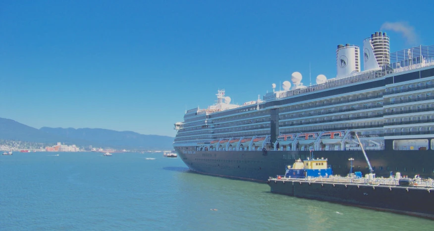 a cruise ship docked at a pier in the water