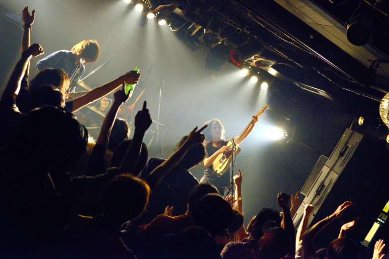 a concert at a concert with people cheering