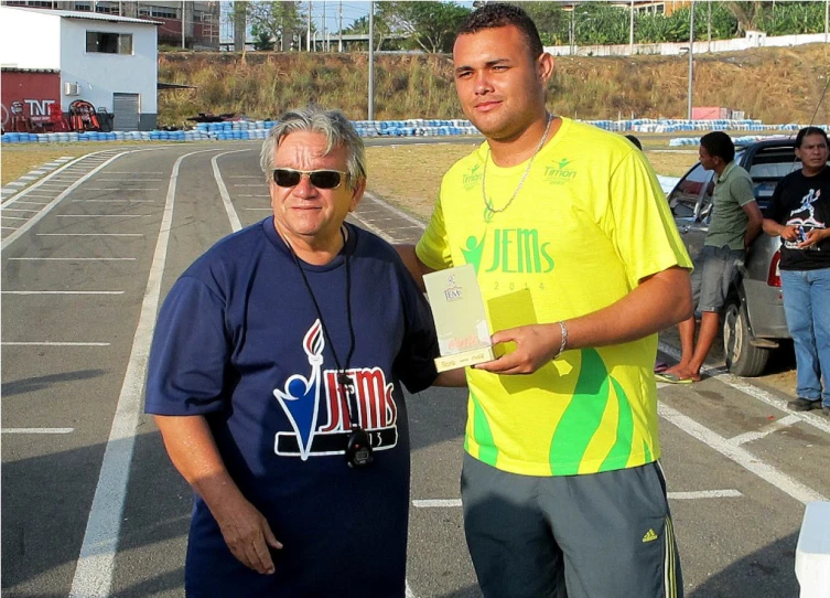 a man is standing next to another person in sunglasses