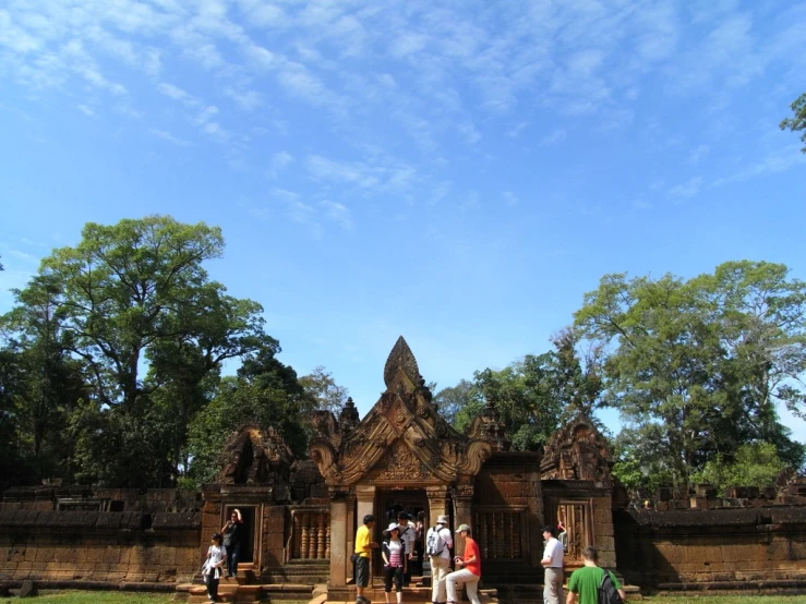 a group of people stand outside of a building