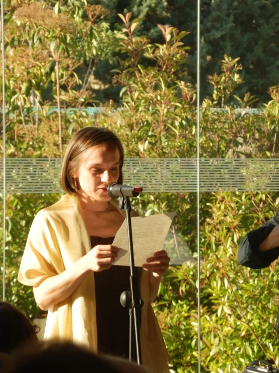 two people standing on the stage speaking