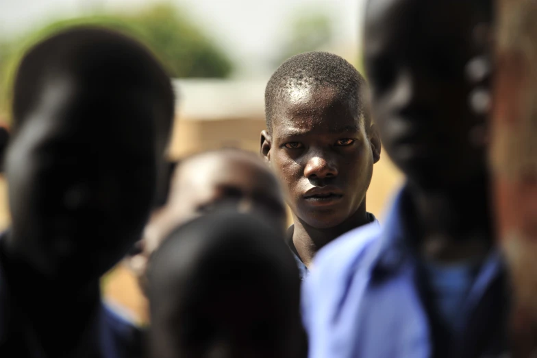 a group of people are looking at the camera