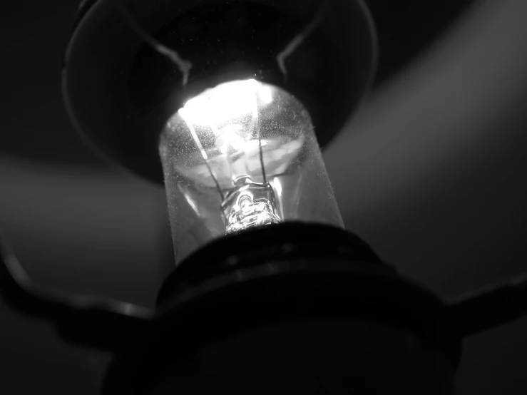 an old - fashioned style, clear light bulb is lit up