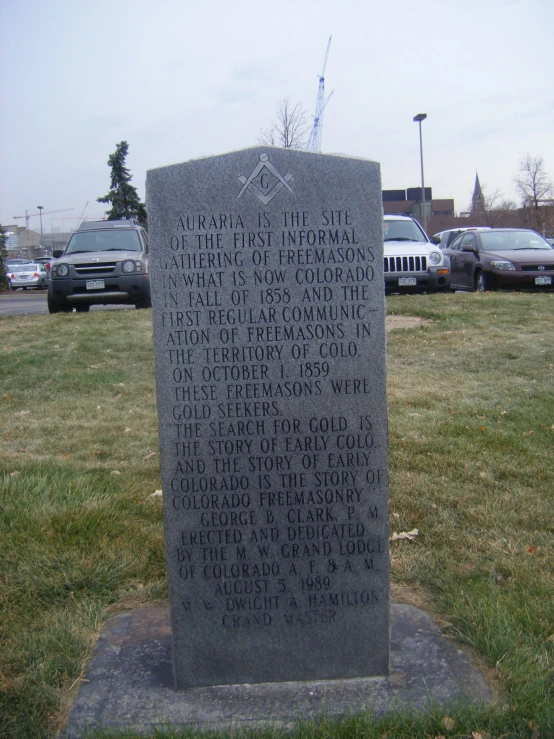monument to robert f lincoln in front of buildings and parking lot