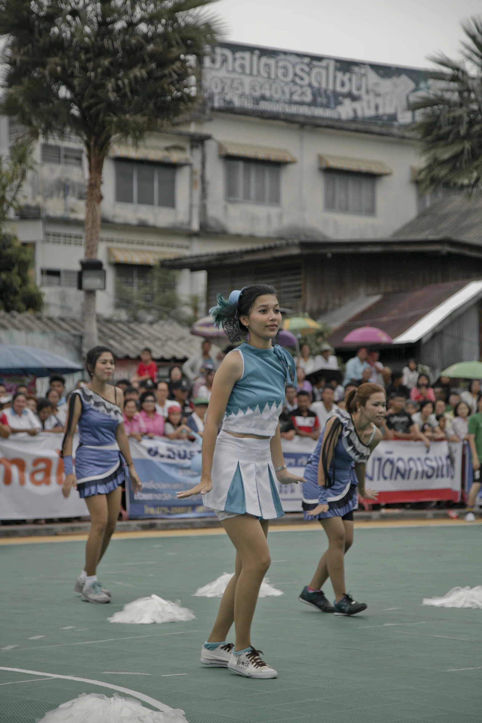 two women on a court playing with a tennis ball