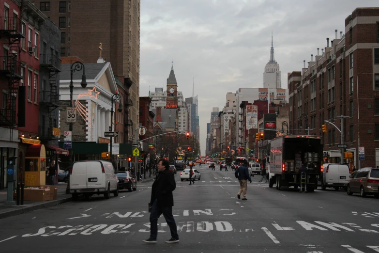 a street filled with traffic and tall buildings