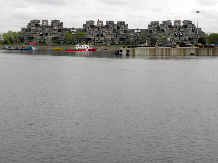 a body of water with boats in front of buildings