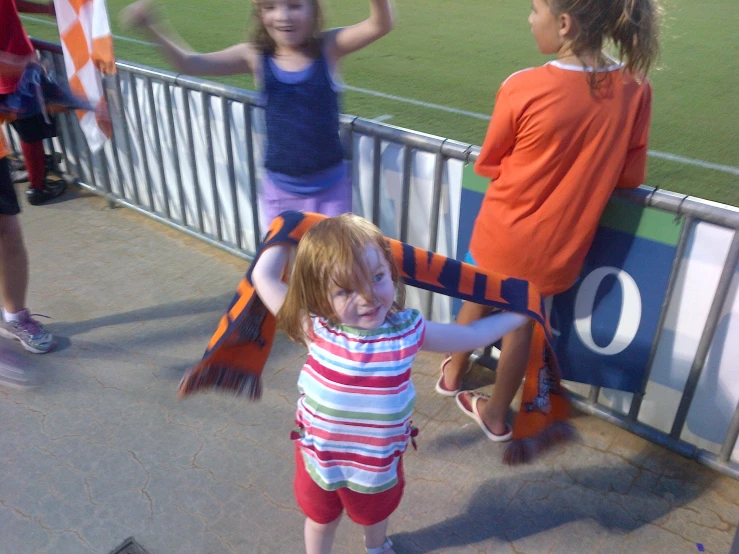 two little girls are playing with each other