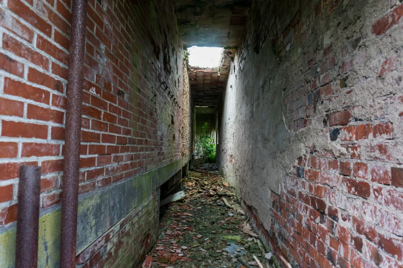 a narrow alley way in an old brick building