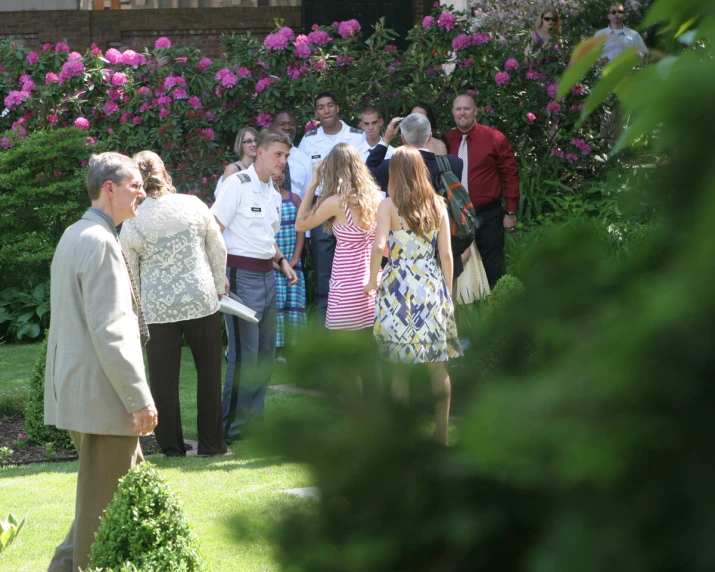 a man and woman are in the grass outside