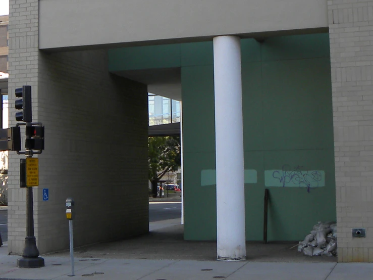 the corner of an outside building with some large pillars