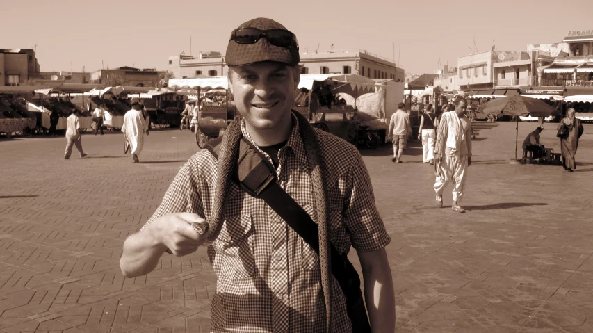 a man is posing for a picture in the street